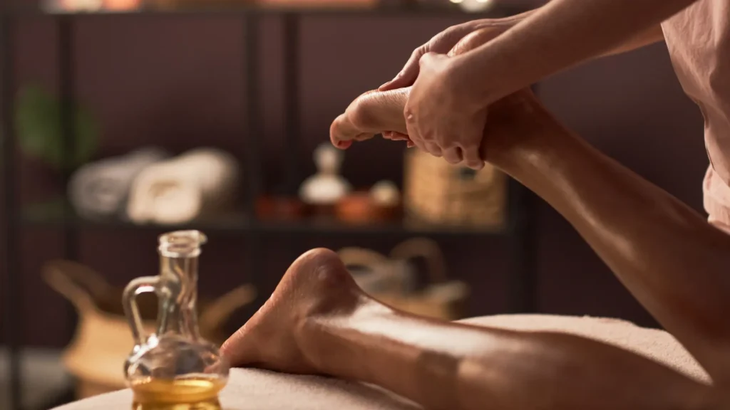 Spa treatment setting with warm towels, oils, and a quiet restorative atmosphere